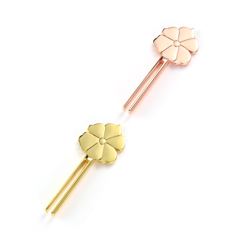 Lächelnder, blumenförmiger Tubenquetscher aus Zinklegierung Lächelnder, blumenförmiger Tubenquetscher aus Zinklegierung